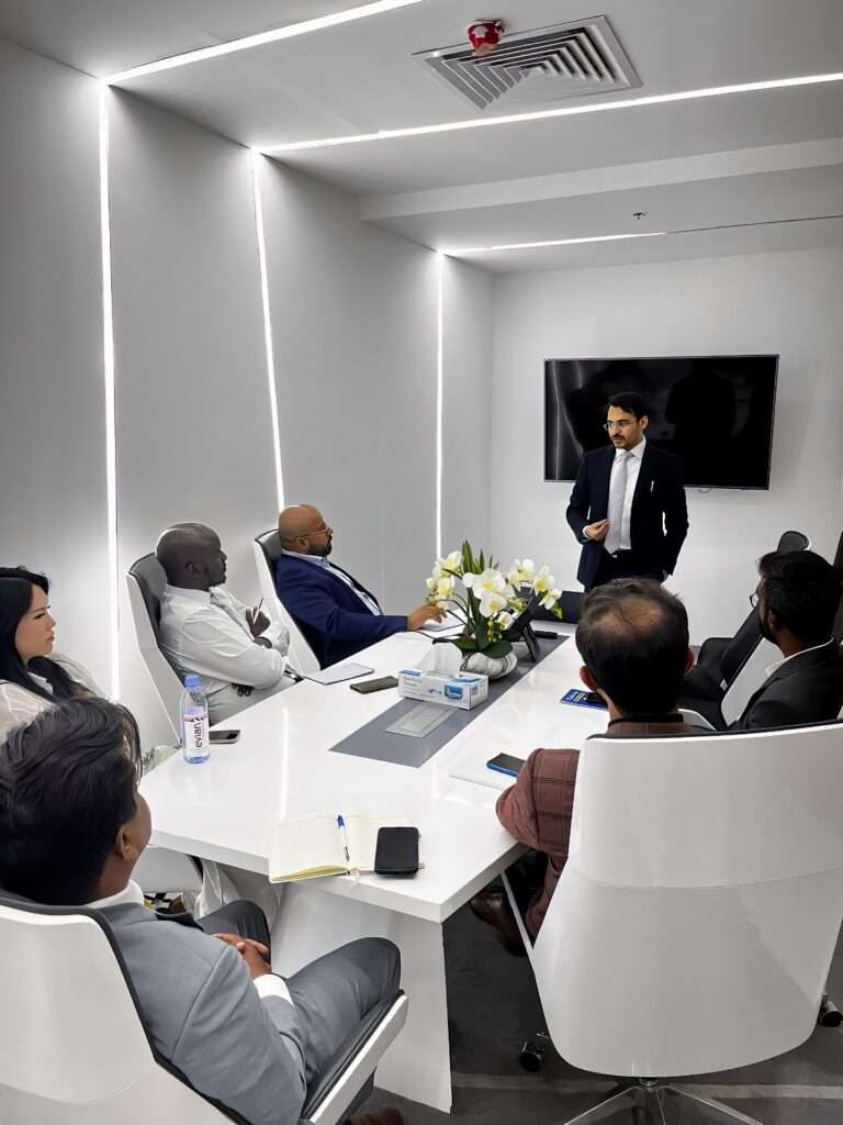 Mohammad Aftab, The CEO and Founder of Truss Real Estate, presents the latest market trends to his team in their Dubai office conference room.